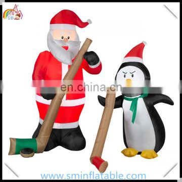 Commercial led inflatable santa claus& penguin, ice hockey game inflatable ornament, christmas outdoor display entertainment