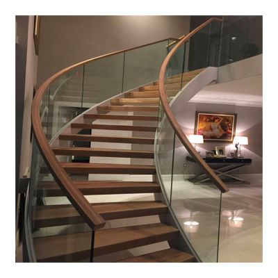 New design modern carbon steel stringer cast iron staircase design glass railing metal beam curved staircase