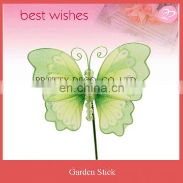 Green butterfly with spring in back and movable wooden stick garden decoration
