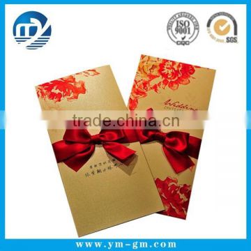 Custom handmade wedding invitation card with flower and ribbon