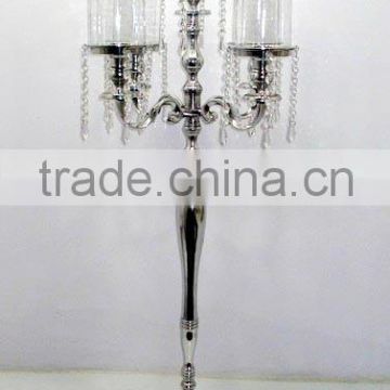 metal candelabra with glass chimney