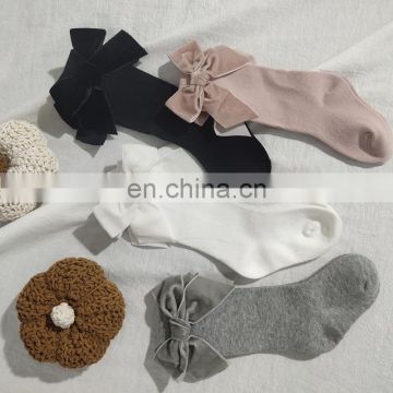 Children's Spain autumn and winter new big bow girl baby socks solid color mid-high long tube socks