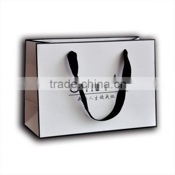 White kraft paper apparel packaging bag with strong ribbon