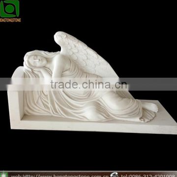 White marble sleeping angel headstone