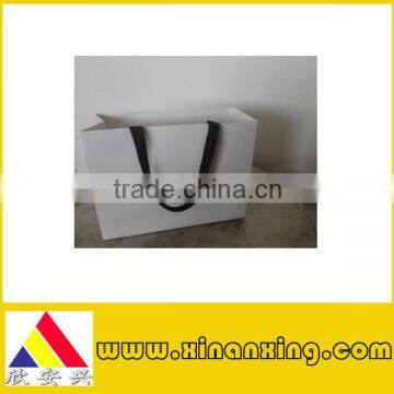 art paper bag with black ribbon