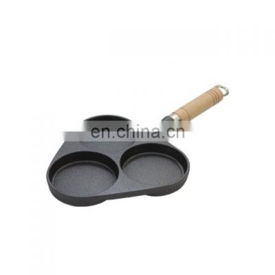 Cast iron divided 3 egg frying pan with wood handle