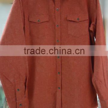 Men's orange long sleeve shirt with two chest pockets and metal button