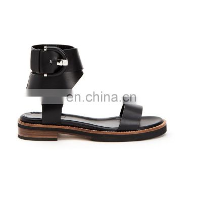 women Leather strappy flat sandal shoes with a covered buckle on a stakced high heel shoe