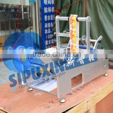 Guangzhou Sipuxin new design semi-automatic round bottle labeler