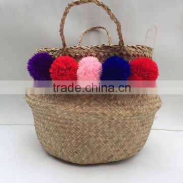High quality best selling eco-friendly Natural seagrass baskets with color pompoms from Vietnam