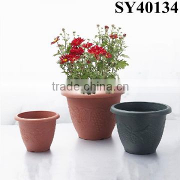 Small colorful round plastic flower pot