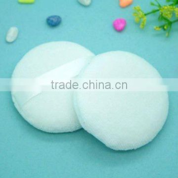 cosmetic cotton puff , round and white color