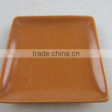 Stock glazed porcelain square sauce dish