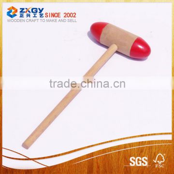 small wood hammer with red color on head hammer