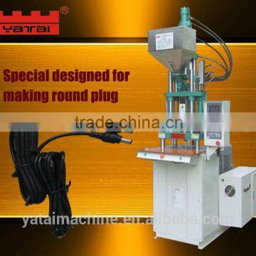 Round plug injection molding machine