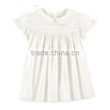 Toddler girl's smocked white dress with collar design