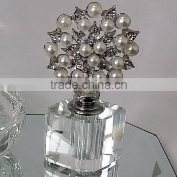 empty perfume bottle with jewelled flower top