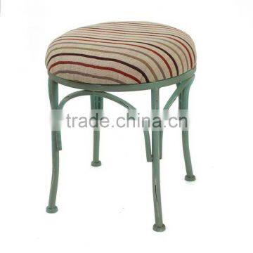 tubular metal chair with linen cushion