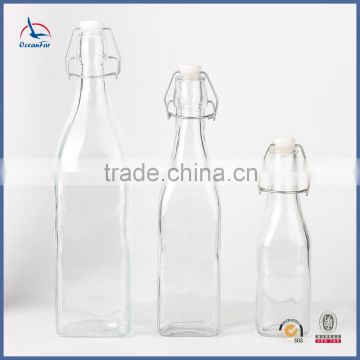 Wholesale Market Bulk Clip Lid Fruit Juice Glass Bottle Transparent Fashion Square Glass Water Bottle