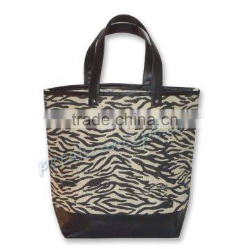 Zebra print bag with leather trimmed handle