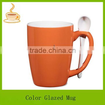 orange color glazed coffee mug / coffee cup with spoon