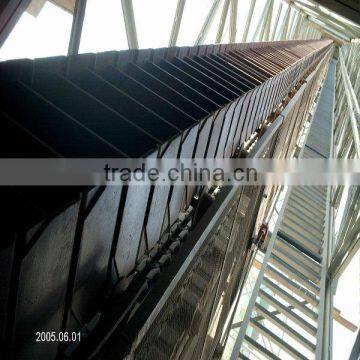Low maintenance conveyor troughing idler for cement plant