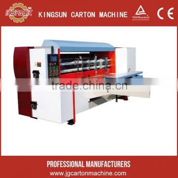 Computer-controlled cellular paperboard carton making machine with rotary cutter