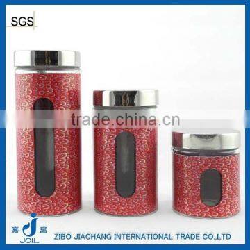 red glass jar with stainless steel lid