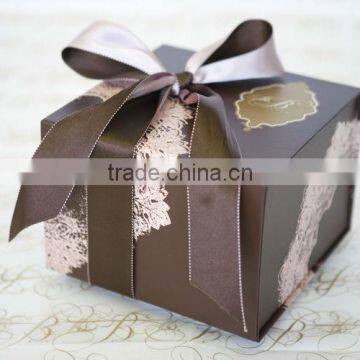Delicate paper folding gift box with ribbon