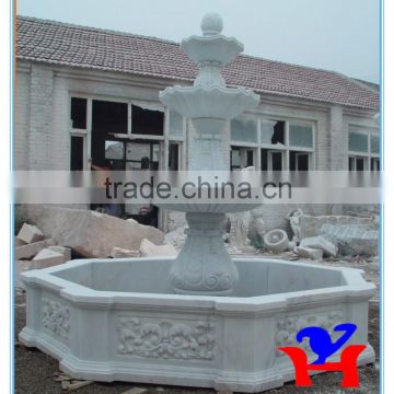 white marble fountain outside used