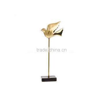 gold plated flying bird sculpture
