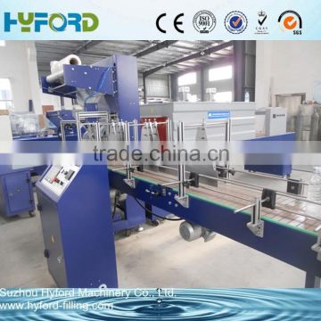 Automatic pet bottle shrink wrapping machine