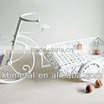 white tricycle fruit plates