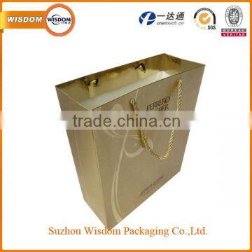 Hot popular luxury foil paper gift bag with golden rope handle