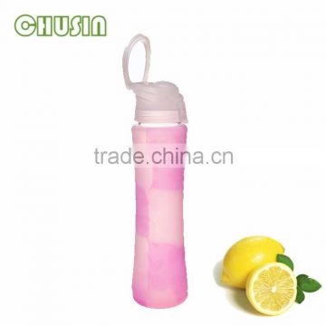 heat-resistant glass water bottle with food grade silicone sleeve and beautiful silicone sleeve and handle and straw