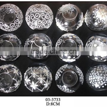 a set of clear glass round tealight holders