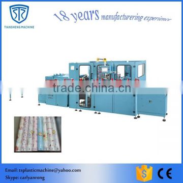 Automatic heat shrink wrapping machine to pack wallpaper
