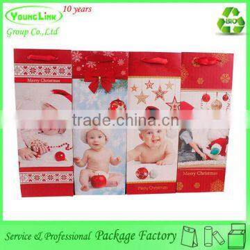 Adorable child toy christmas paper bag with ribbon