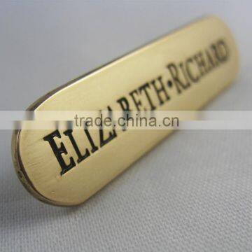 small metal logo name plate