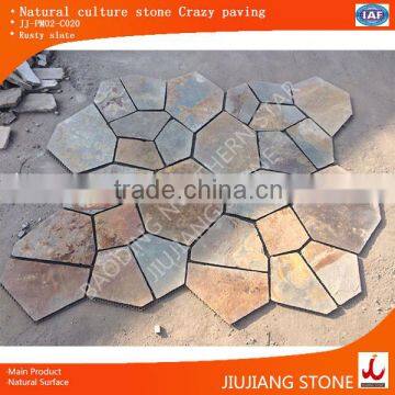 Rusty interlocking paving stone on mat