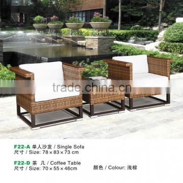 light brown rattan coffee table and sofa