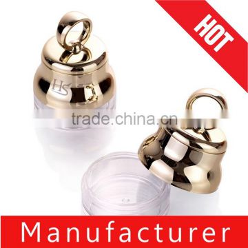 Small round gold cosmetic powder container