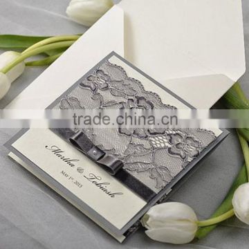 Gorgeous & elegant white wedding invitations with gray borders & floral laces ribbon bow