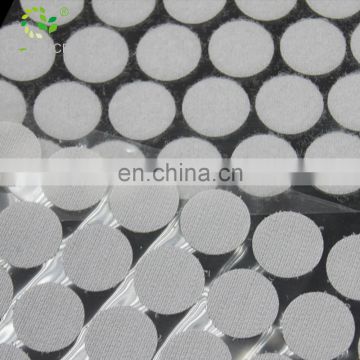 Strong self - sticky Nylon & Polyester white color hook and loop dots with clear film backing