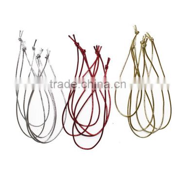 metallic gold knotted tag elastic loop