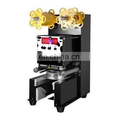 Milk tea automatic sealing cup machine / commercial soy milk pearl milk tea cup paper cup sealing price