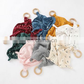 organic cotton infant baby knotted comforter blanket with wood teething ring