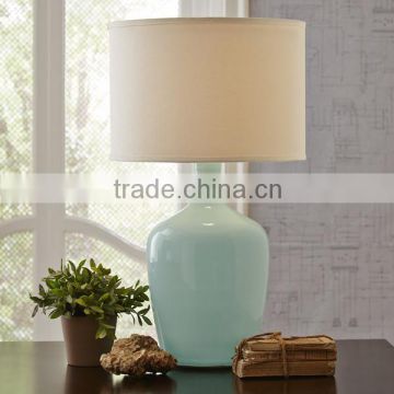 11.21-6 clean look that complements a variety of decor A vase shaped ceramic base Table Lamp