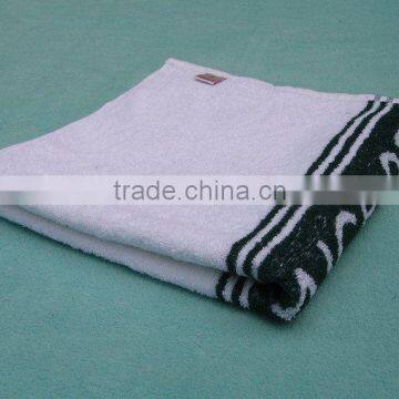 white and black cotton fabric bath towels