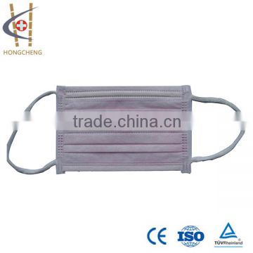 Disposable surgical face mask with shield